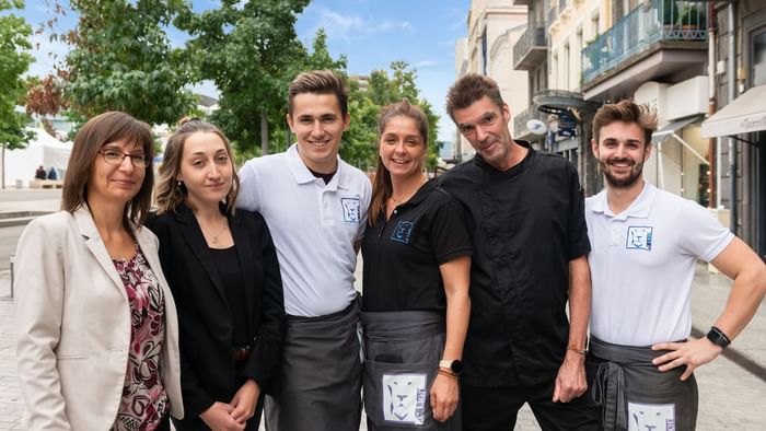 Hotel staff posing for a picture at The Originals Hotels