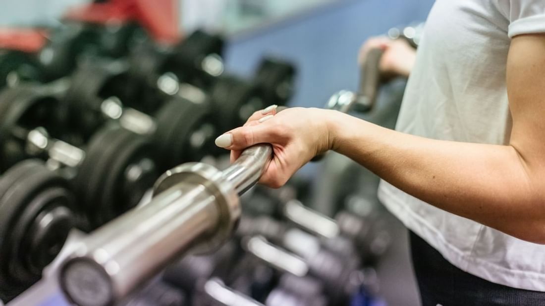 Lifting weights in the gym at Mercure Gold Coast Resort