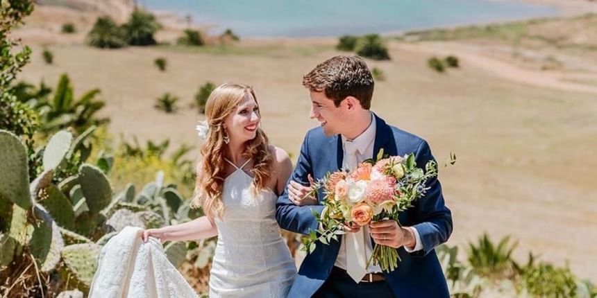 Newly wedded couple strolling on the beach at Catalina Island Company