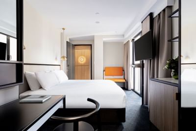 King bed & TV in business room at Brady Hotels Jones Lane