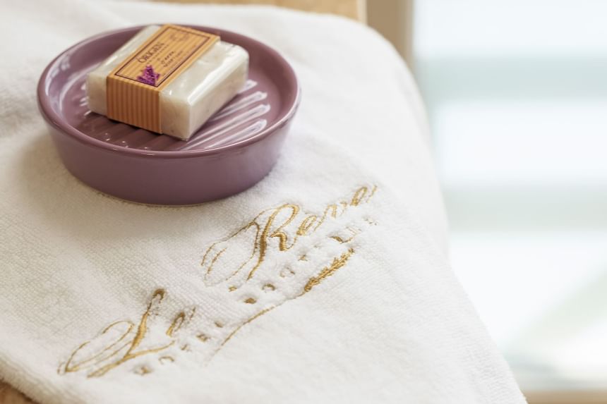 Spa amenities on a towel at Hotel Boutique Le Reve
