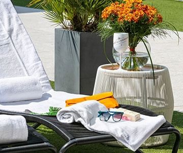 A Garden pouf by a sunbed at Hotel Emperador Buenos Aires