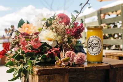 A bouquet with a beer can on a table at Knightsbridge Canberra