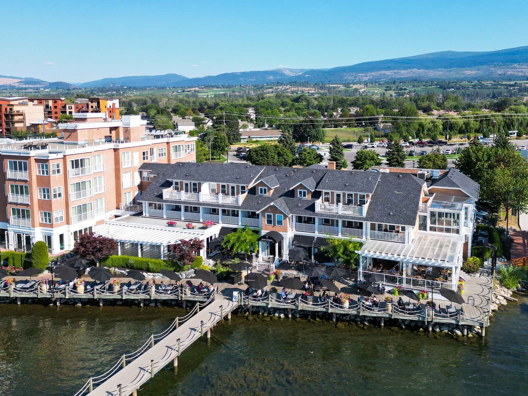 Aerial view of Hotel Eldorado with outdoor seating area on a wooden pier