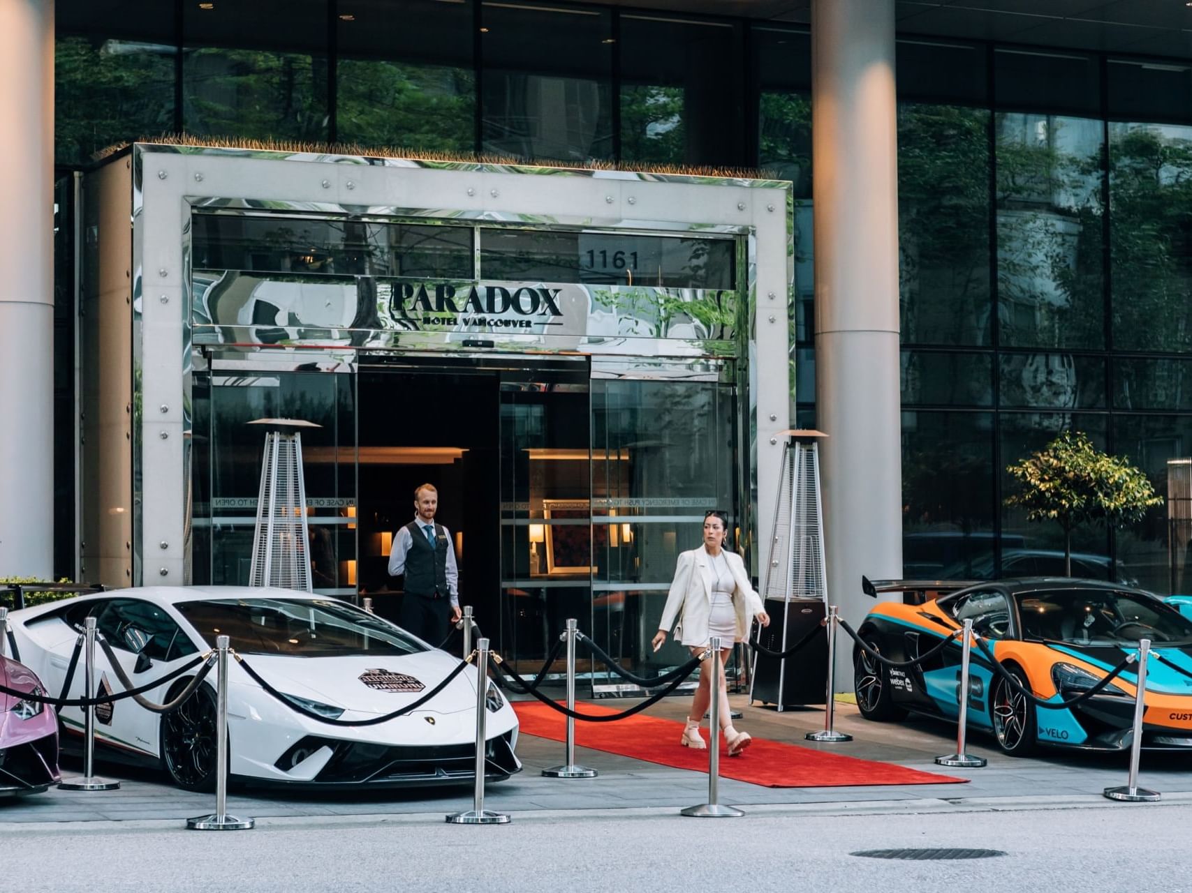 Entrance to Paradox Hotel with lots of supercars outfront
