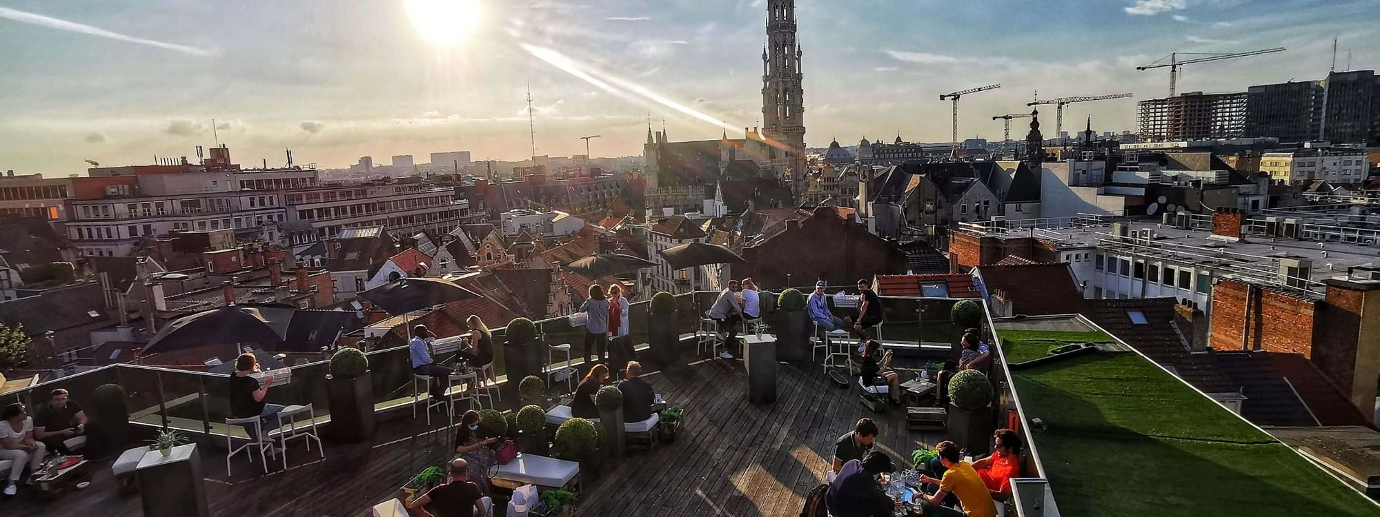 Crowded on a terrace at Hotel Barsey by Warwick - Brussels at sunset