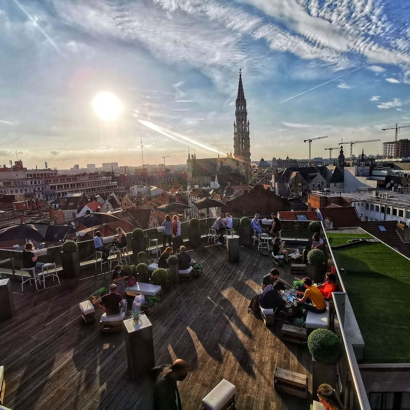 Crowded on a terrace at Hotel Barsey by Warwick - Brussels at sunset