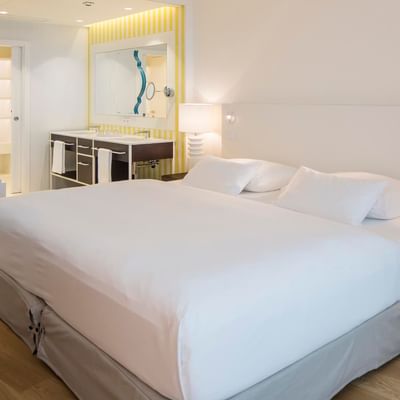 Bed in Seaside Penthouse sea view at Falkensteiner Hotels