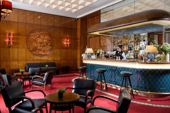 Bar counter with stools & red carpeted floor in Bar 21 at Bettoja Hotel Atlantico