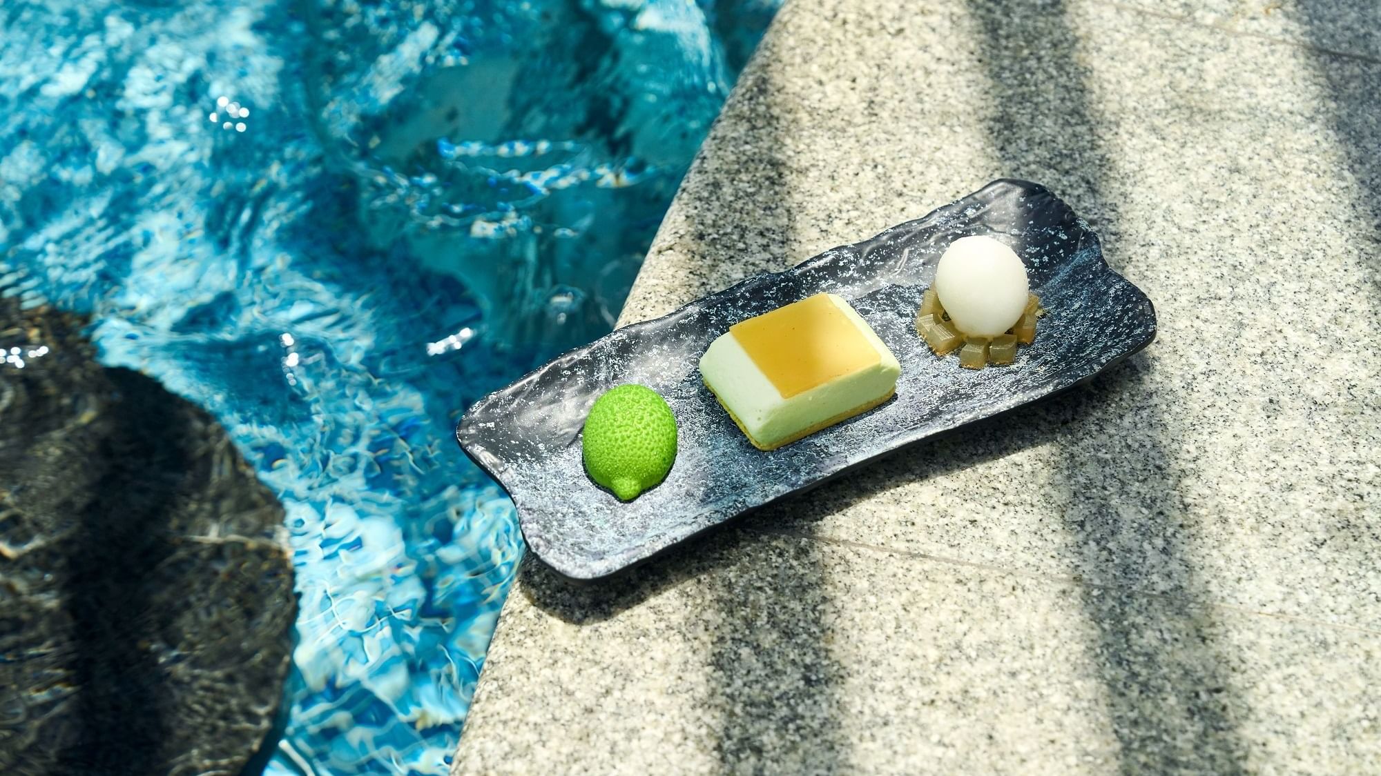 Desserts served with lemon slices in Malibu Deck Pool bar at Paramount Hotel Dubai