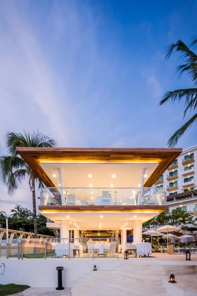 Modern open-air restaurant with twilight sky at Villa Premiere Boutique Hotel & Romantic Getaway