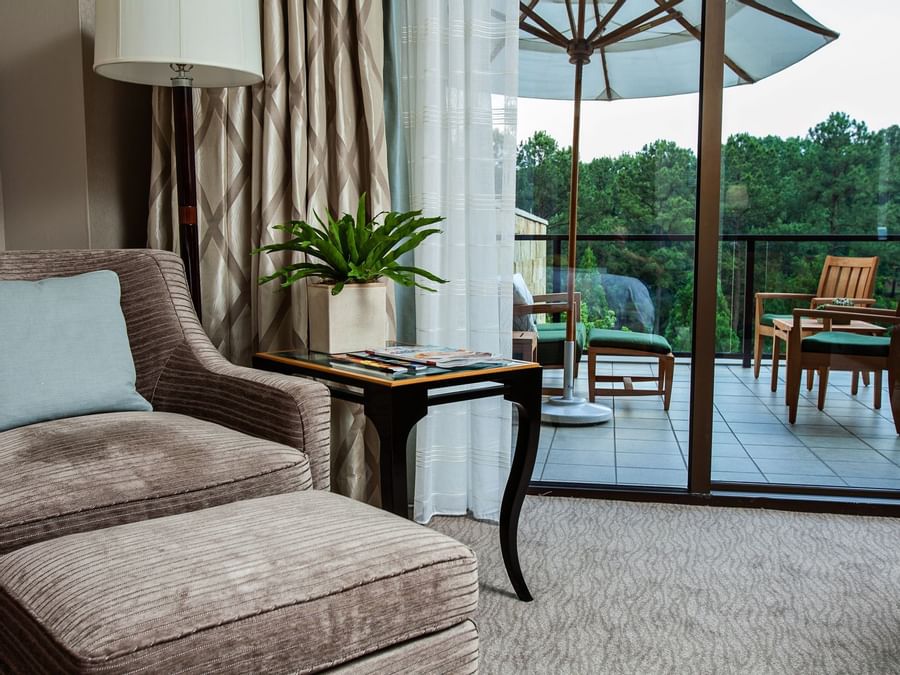 Comfy lounge area in Superior Lake View Balcony King at The Umstead Hotel and Spa