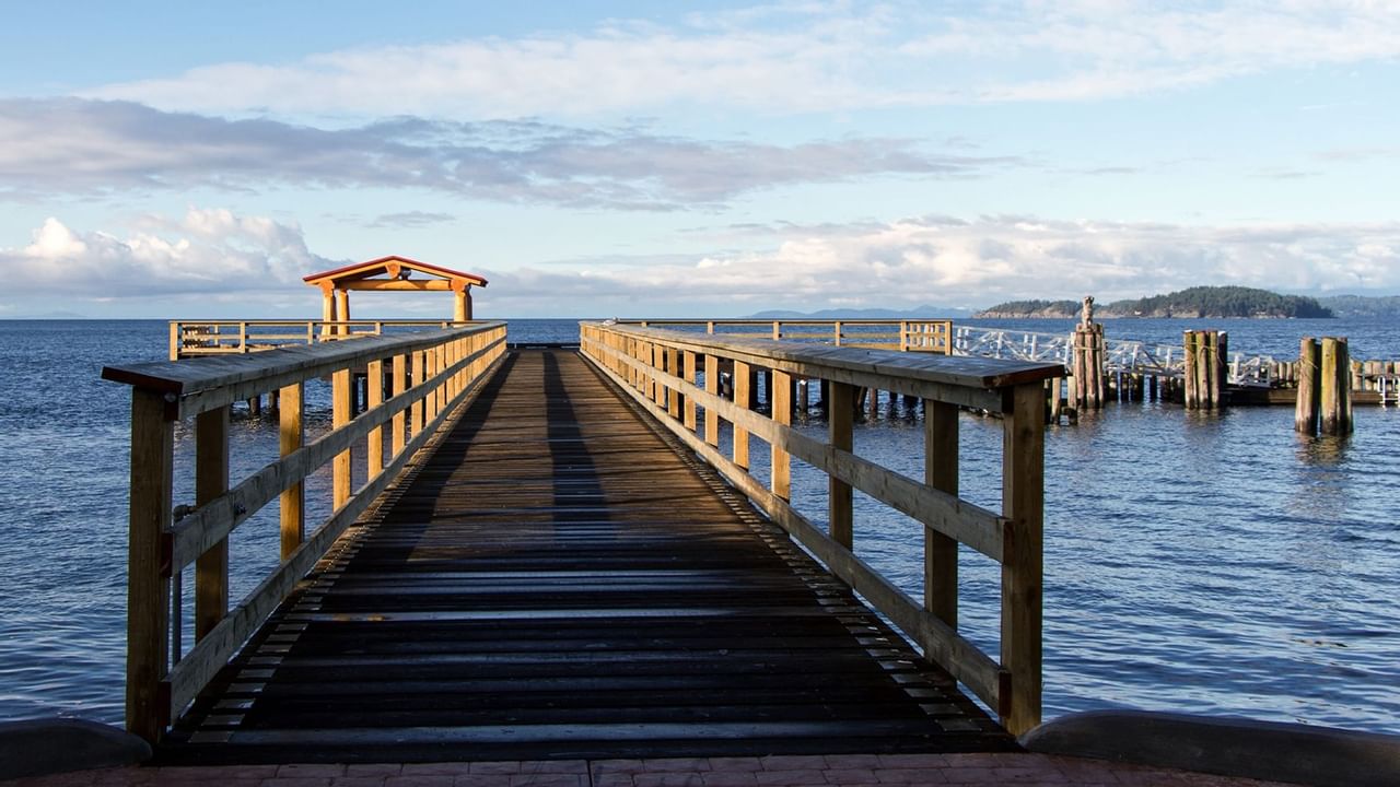  A long wooden fishing pier near The Oceanside Hotel
