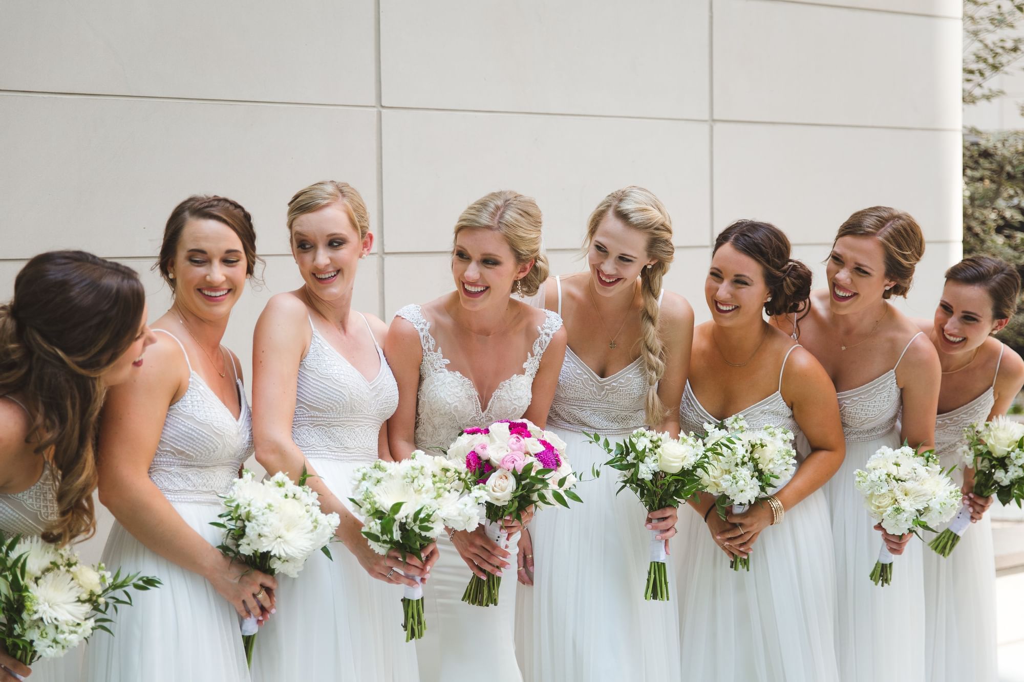 A group of bridesmaids holding flowers at Grove Hotel