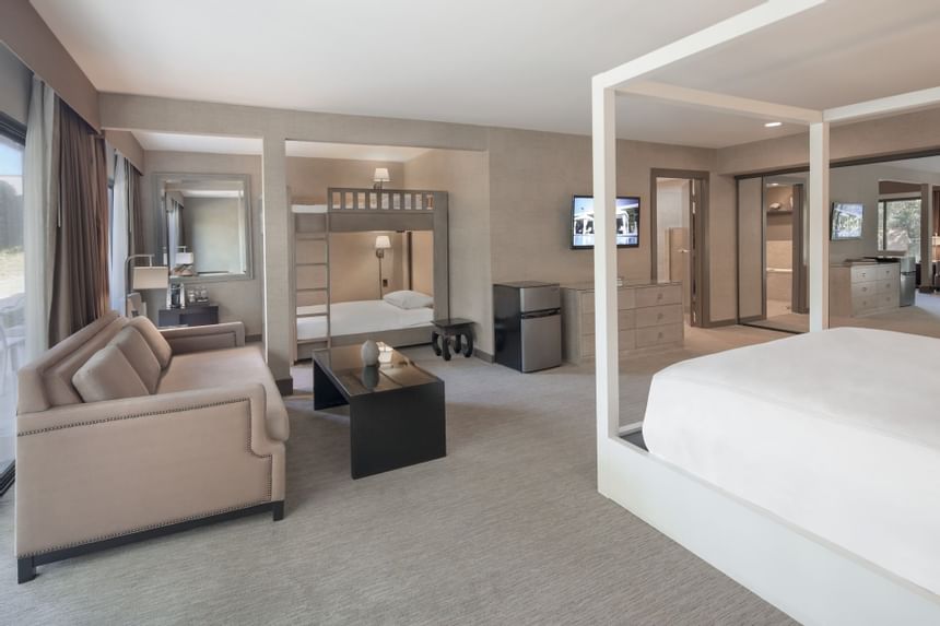 Family Suite with comfy sofa and bed at  Luxe Sunset Boulevard