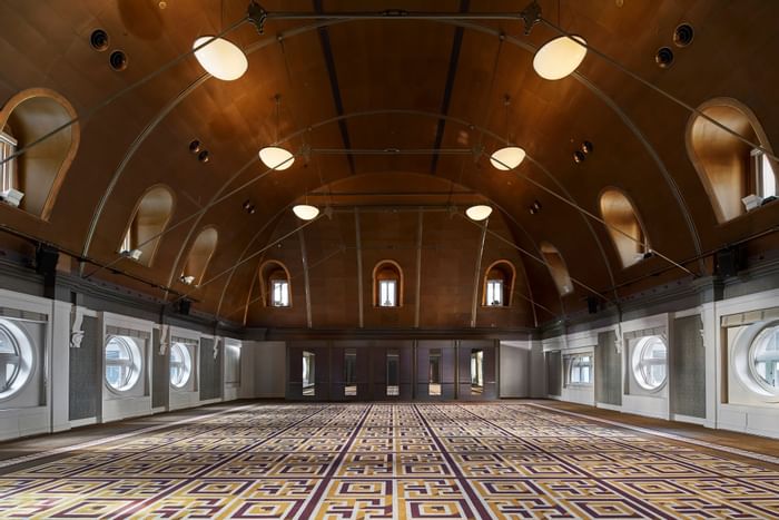 Interior of Heritage Ballroom with arched ceiling and patterned carpet at The Fullerton Hotel Sydney