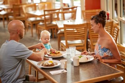 Family enjoying breakfast in Ilima Cafe at Waikiki Resort Hotel by Sono