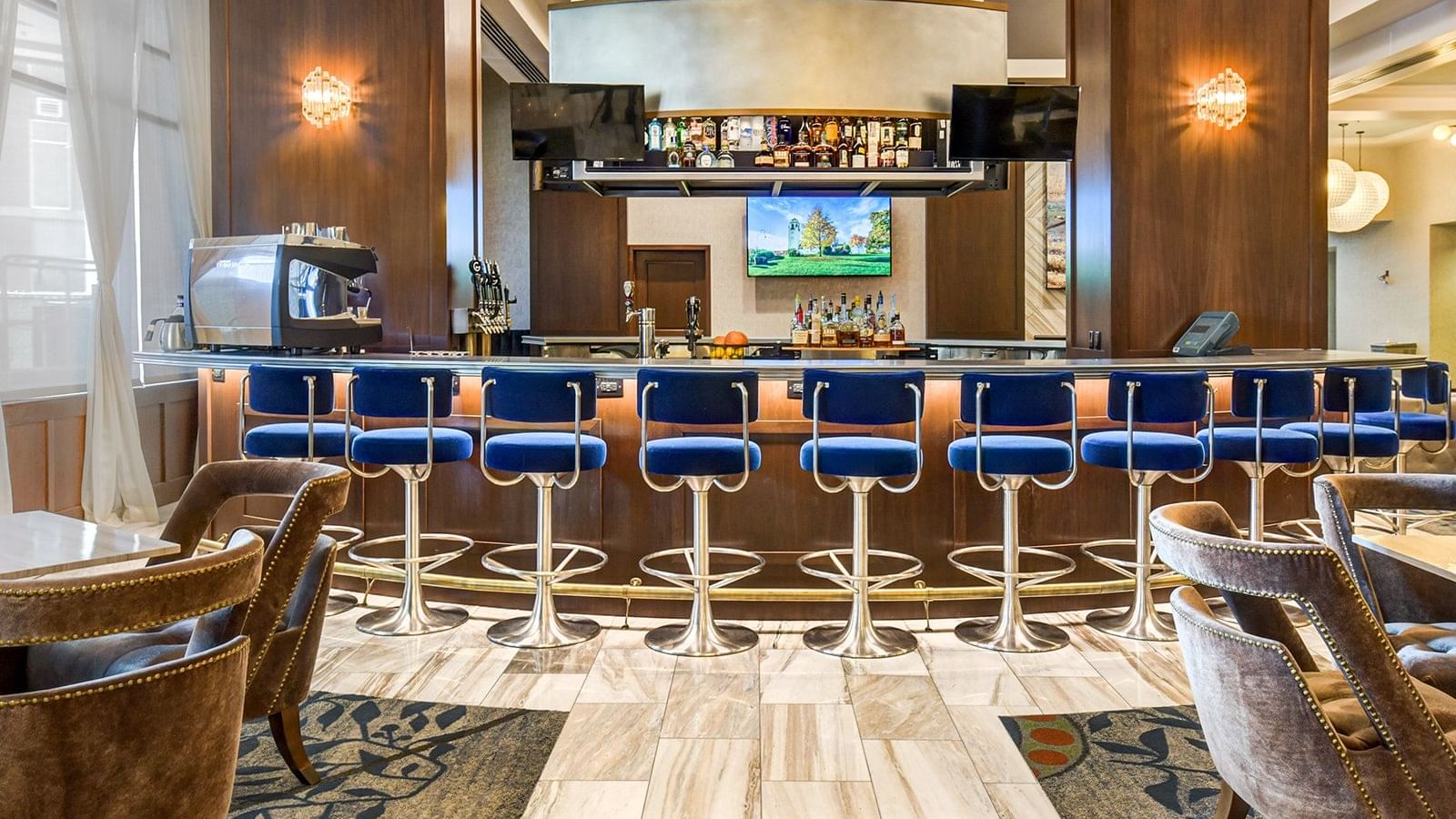 a row of bar stools at a bar