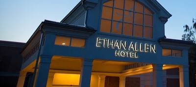 Exterior view of the hotel at twilight of Ethan Allen Hotel