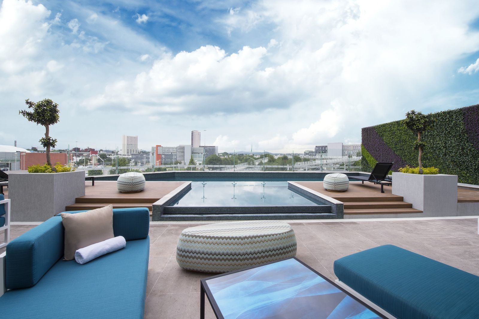 An Outdoor infinity pool on a rooftop at Grand Fiesta Americana