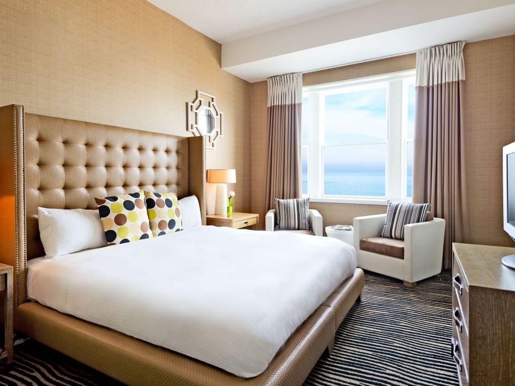 a bed facing a TV in a hotel room
