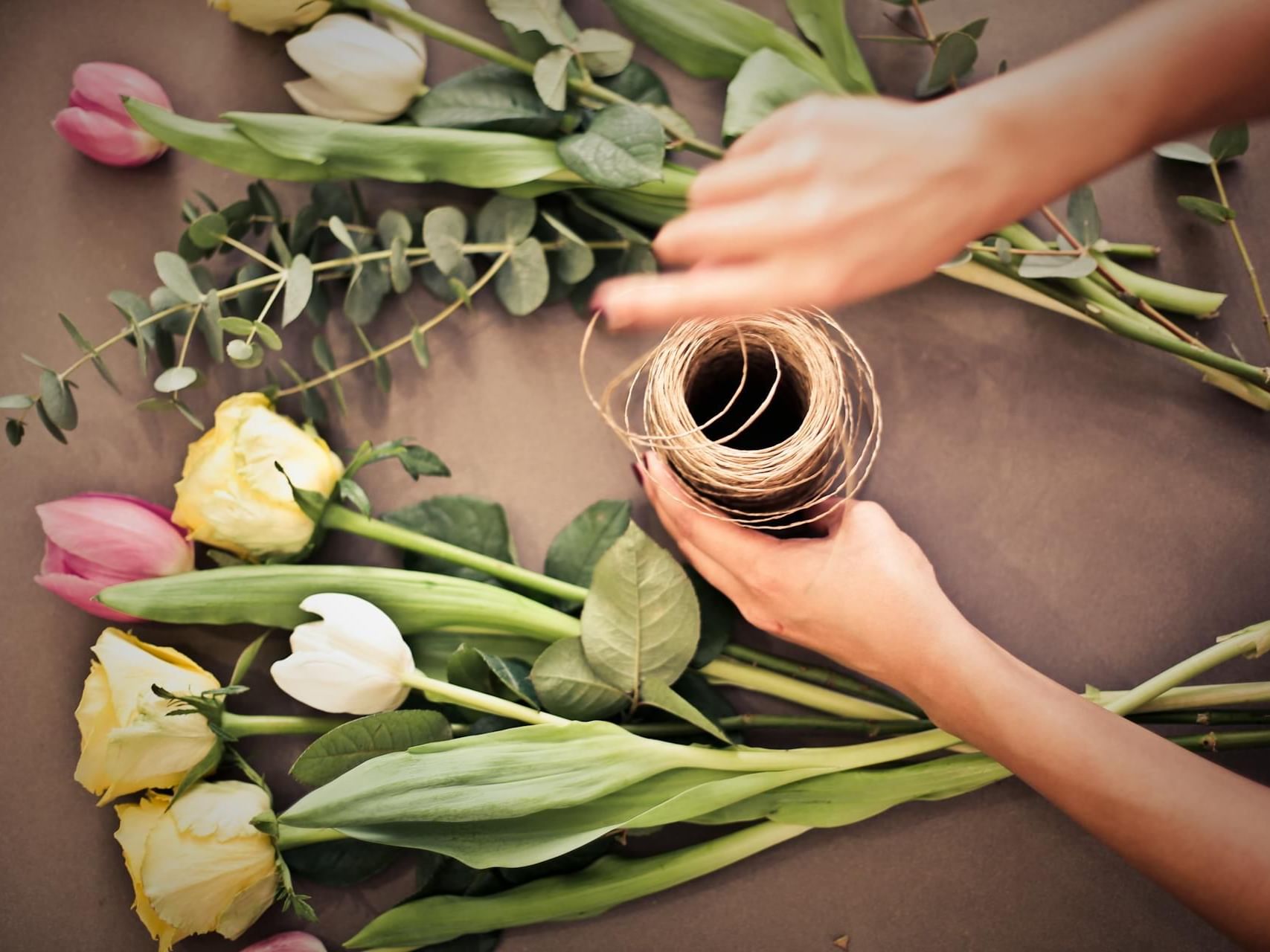 Top view of a Florist arranging a bouquet of flowers at Ananea Madivaru Maldives