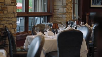 Set up banquet by the window in Ruth's Chris Steak House at Hotel Park City Autograph Collection