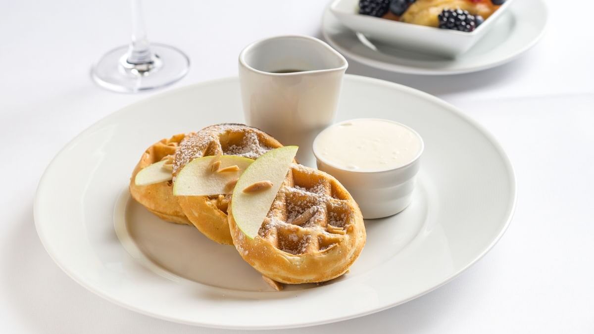 Closeup of breakfast waffles & fruits served at Brazilian Court