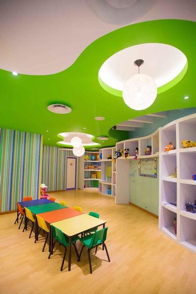 Table with chairs in Kids' play area at Buenaventura Grand