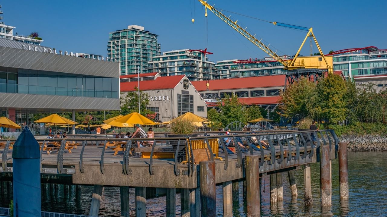Yellow umbrellas over picnic tables at the Shipyards