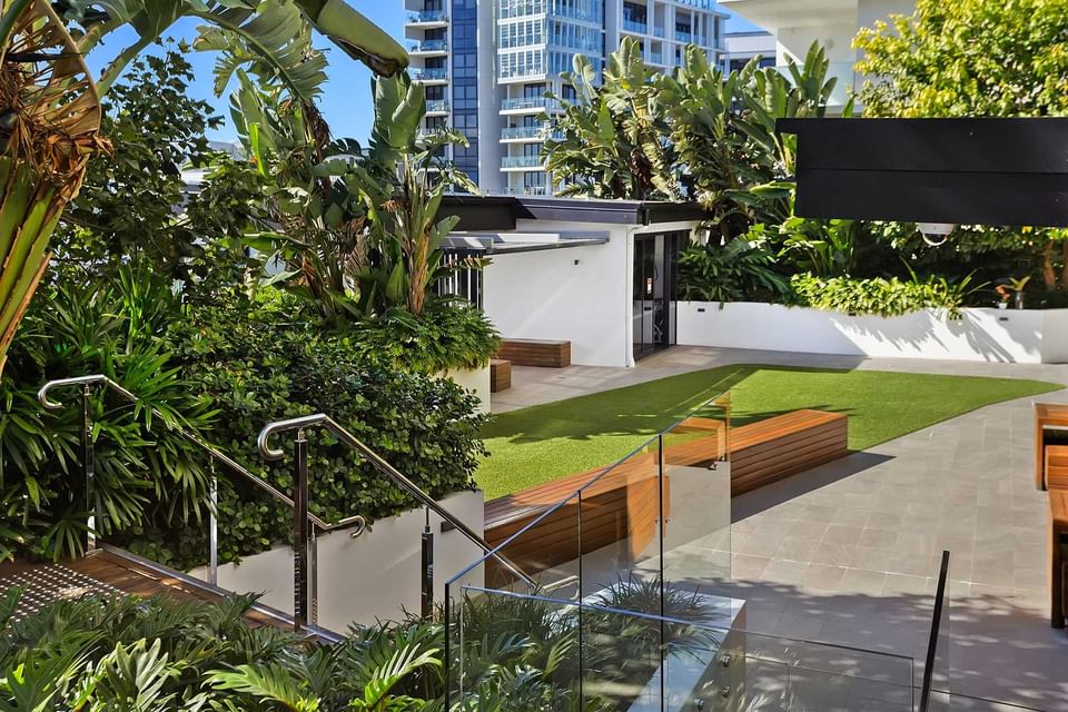 Stairs through greenery plants by the garden outdoors at Alcyone Hotel Residences