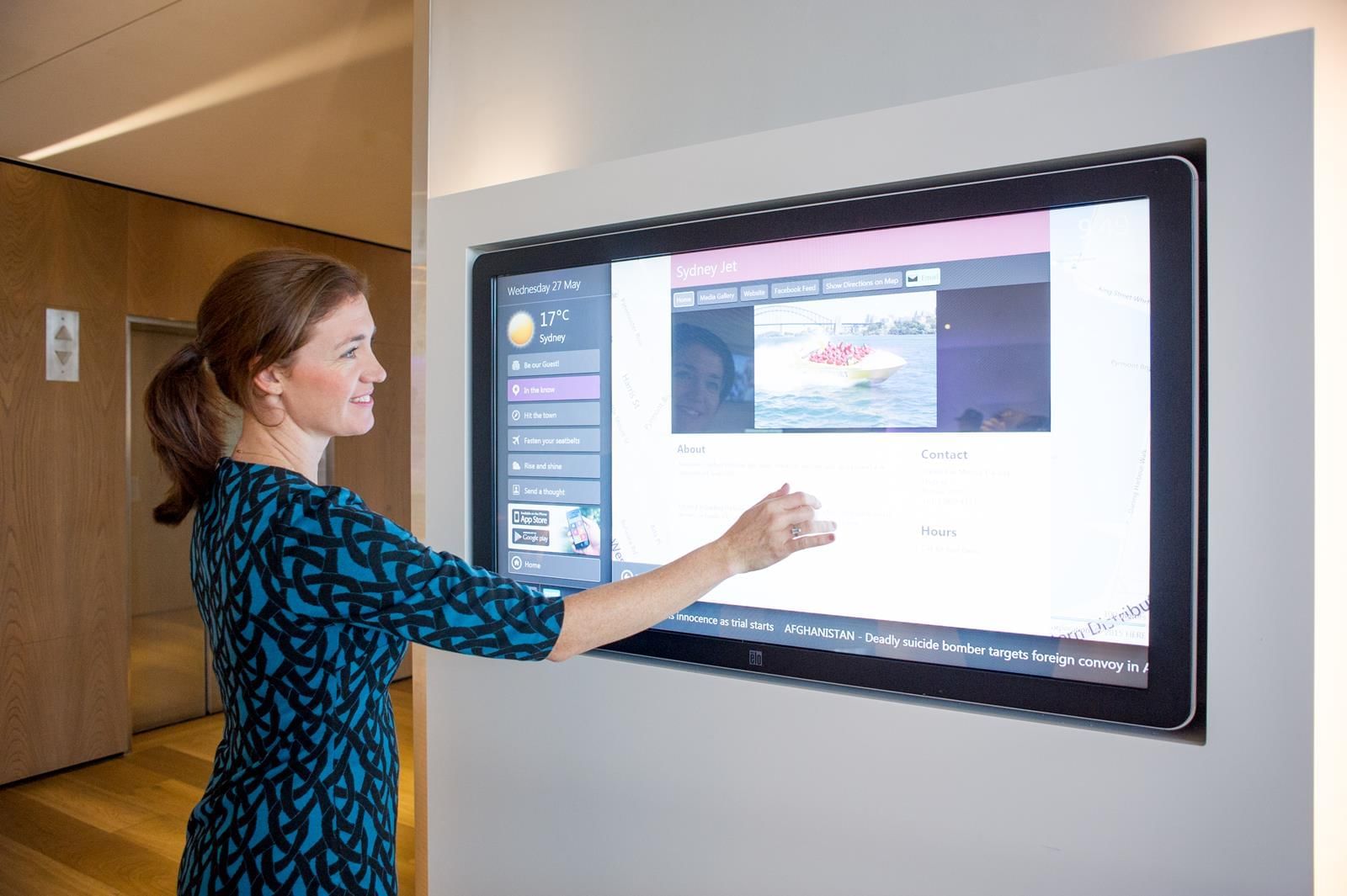 Lady with smart touch screen in Novotel Darling Harbour