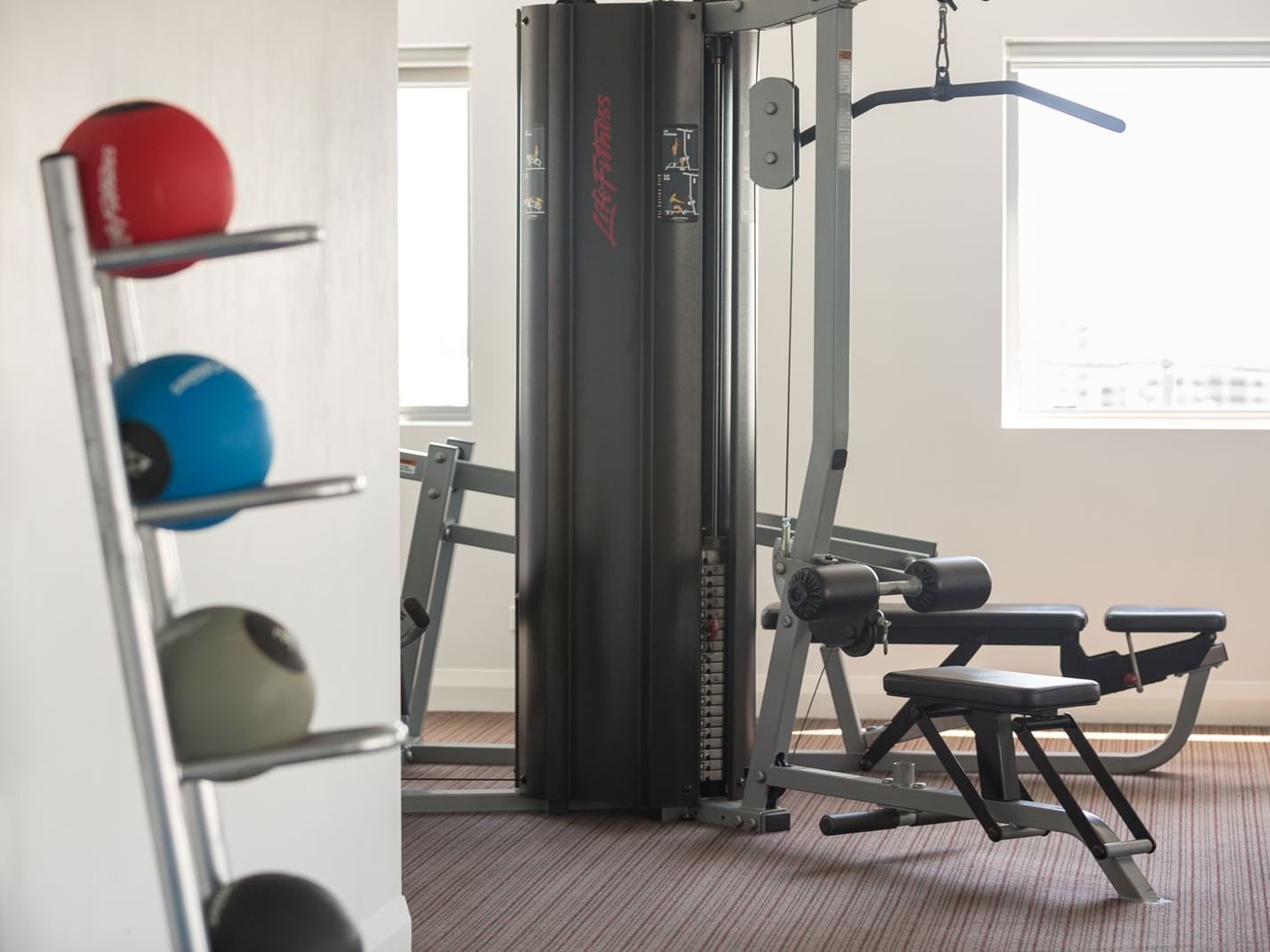 Equipped gymnasium with a cardio area at H On Smith Hotel