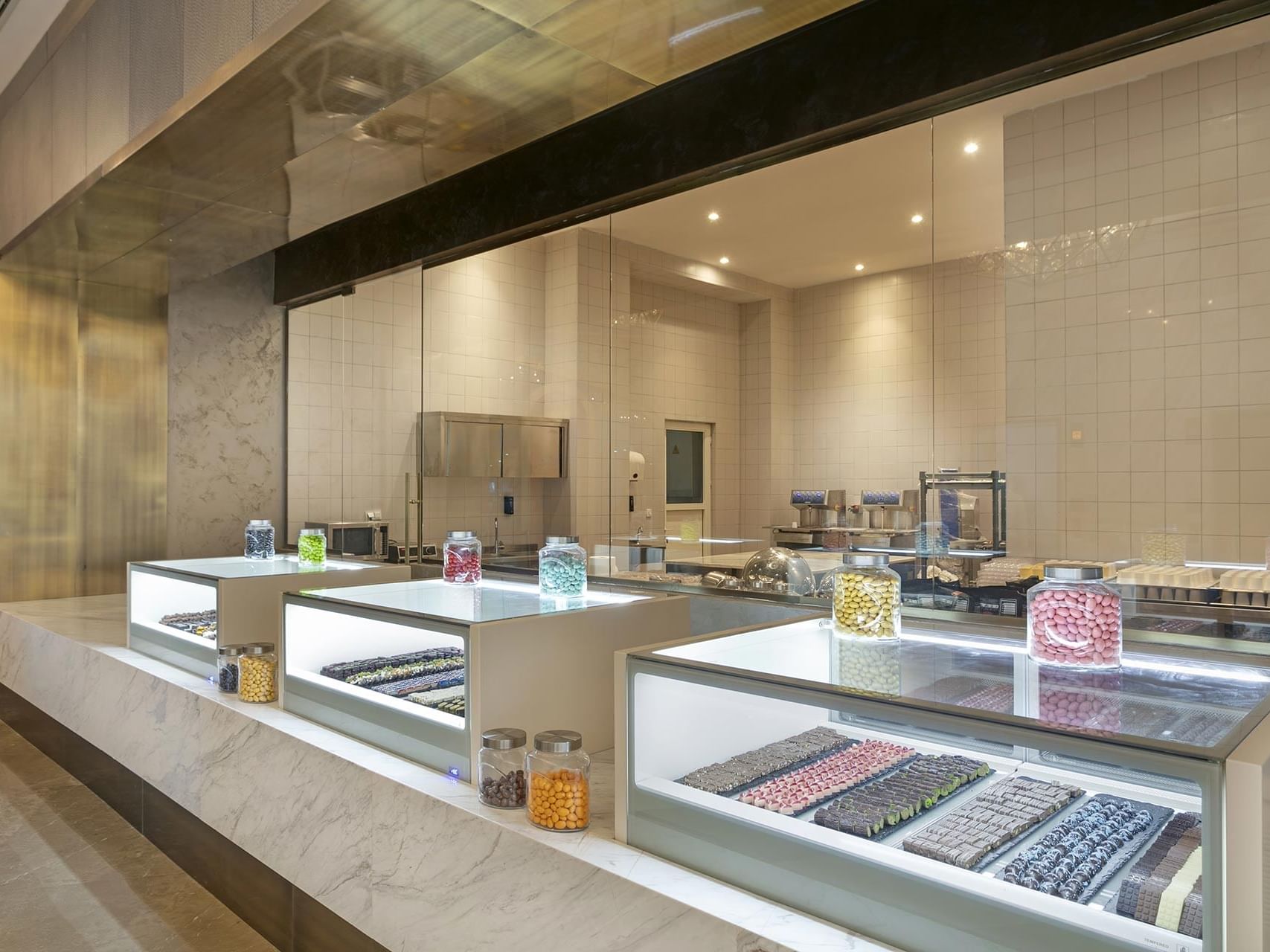 Interior of chocolatier with glass display cases at Cullinan Belek