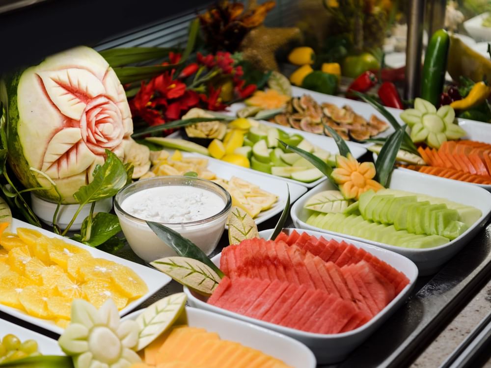 Assorted fruits & vegetables displayed on a buffet table at Fiesta Americana