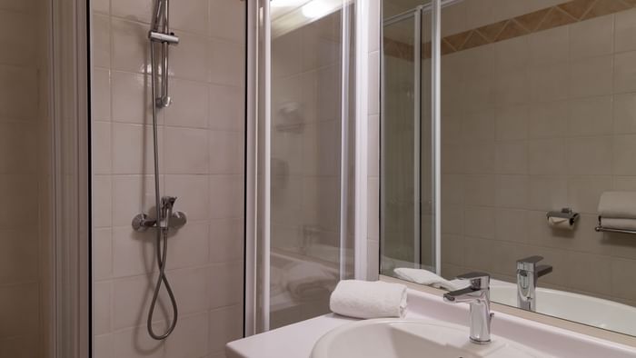 Bathroom vanity in bedrooms at Hotel Cassitel
