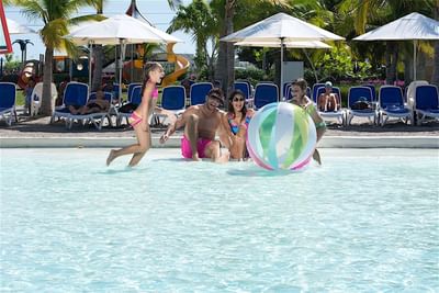 Family having fun in the pool at Playa Blanca Beach Resort