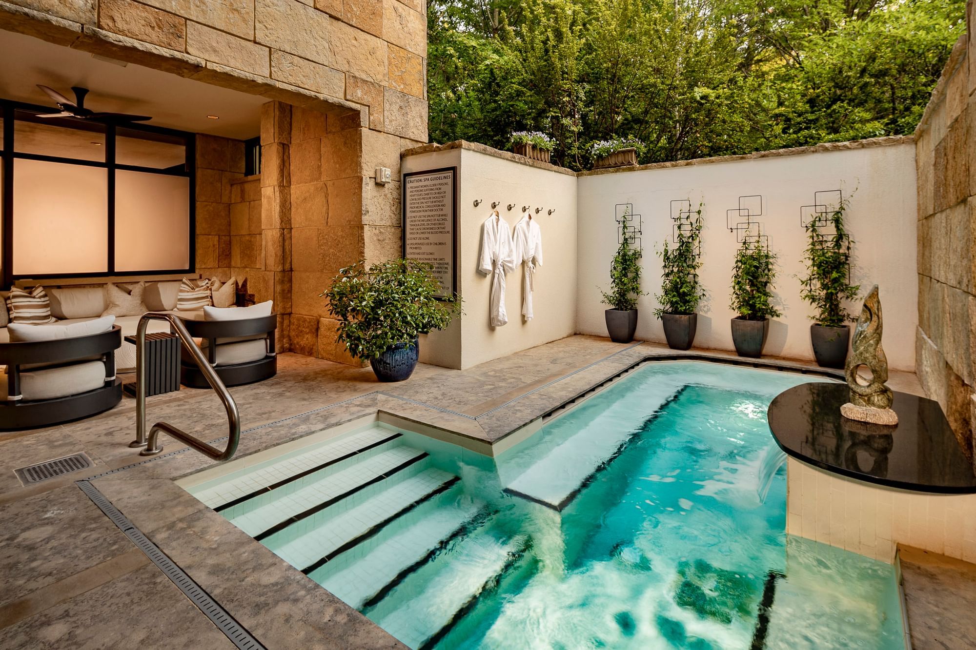 Open pool area with a lounge in The Spa at The Umstead Hotel and Spa