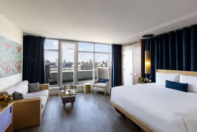 a bed and couch in a hotel room