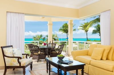 Comfy chairs in living room in 2-bed Oceanfront Deluxe Suite at Windsong Resort On The Reef