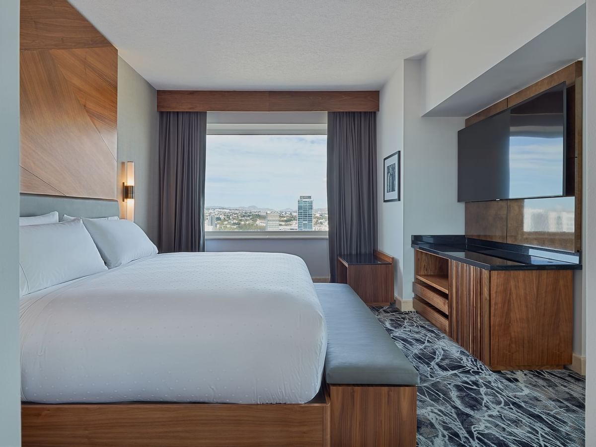 Luxury bed in Deluxe king room at GFA Guadalajara Country Club