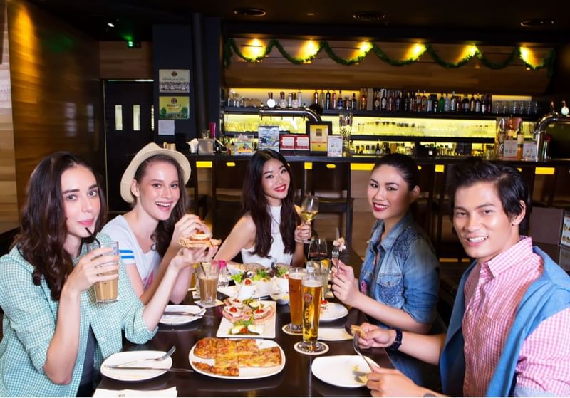 A group of people posing while dining at Sunway Lagoon Hotel