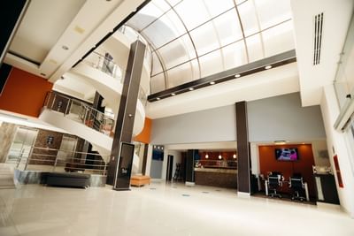 Lobby area with a spiral staircase at Araiza Hermosillo