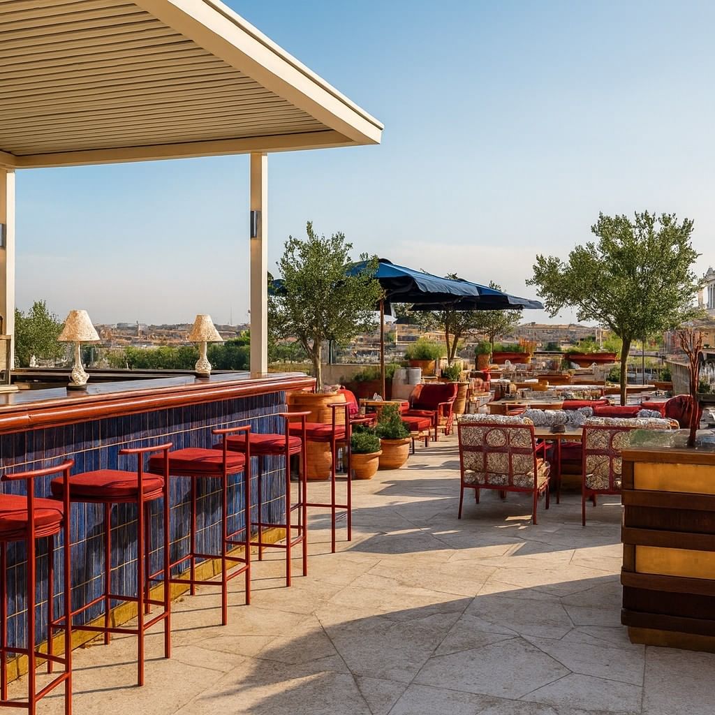 Lyve Rooftop Terrace at Thompson Rome with red stools and lounge seating, overlooking the city from a luxury hotel in Rome