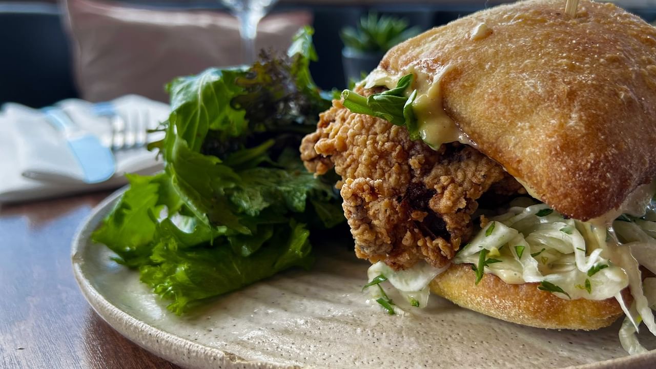 Chicken burger dressed with salad and on a fresh bun