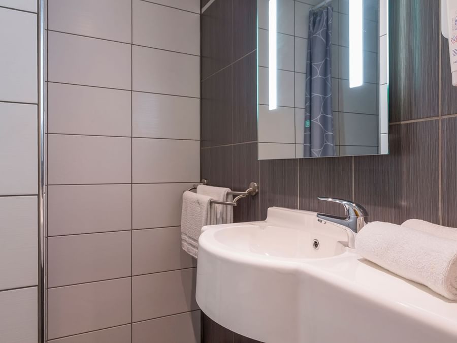 Bathroom vanity in bedrooms at Hotel Aster