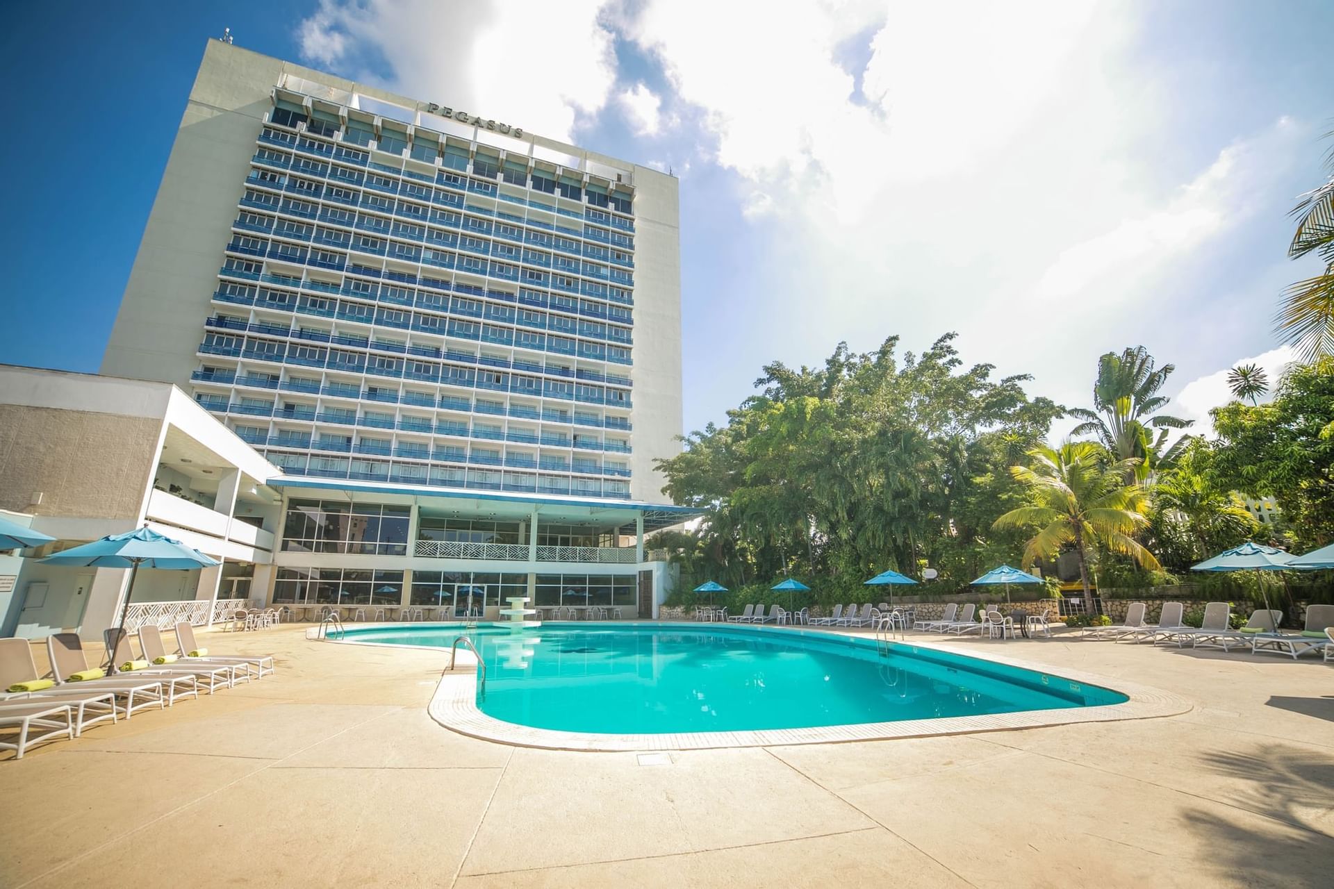 Pool and the hotel exterior view at Jamaica Pegasus Hotel
