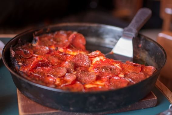 Pepperoni pizza in Pequod’s Pizza near The Godfrey Chicago