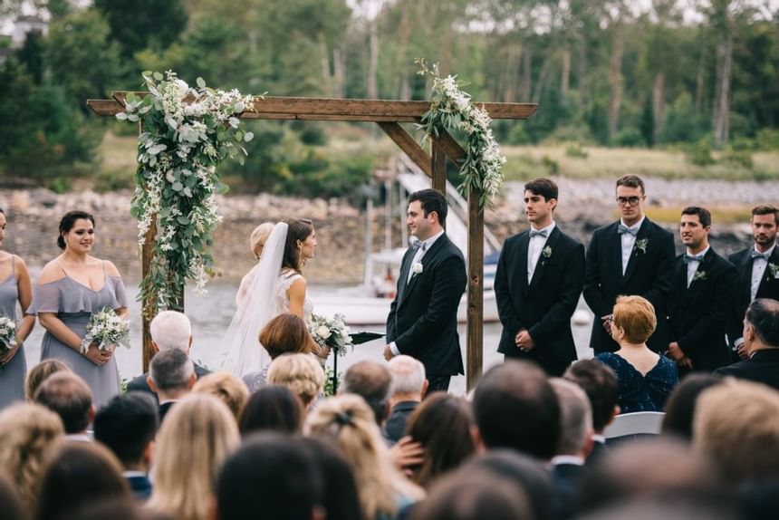 An outdoor wedding ceremony at The Breakwater Inn & Spa
