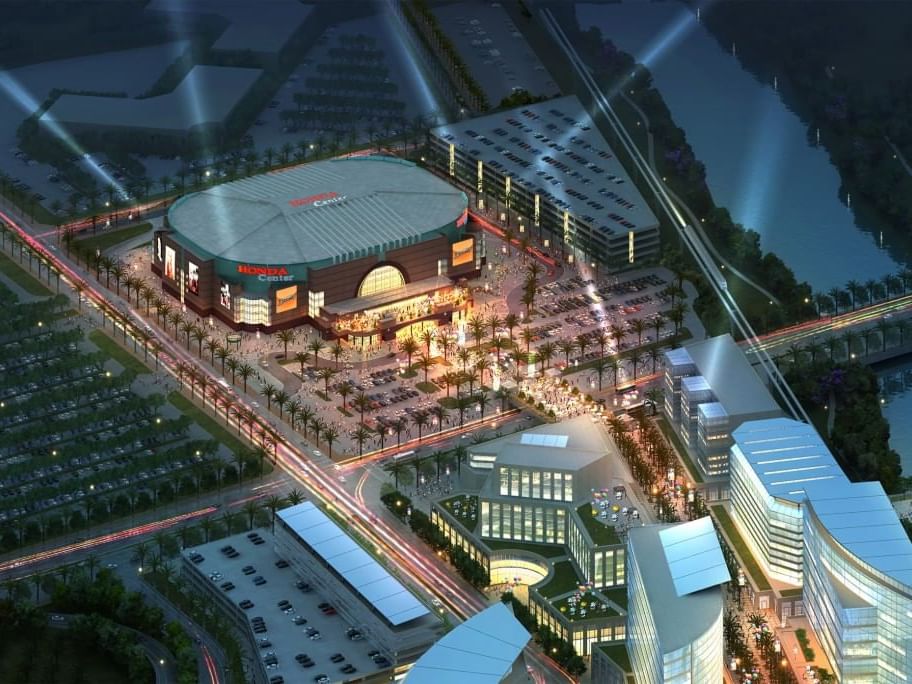 Aerial view of the Honda Center with surrounding buildings and a busy road network.